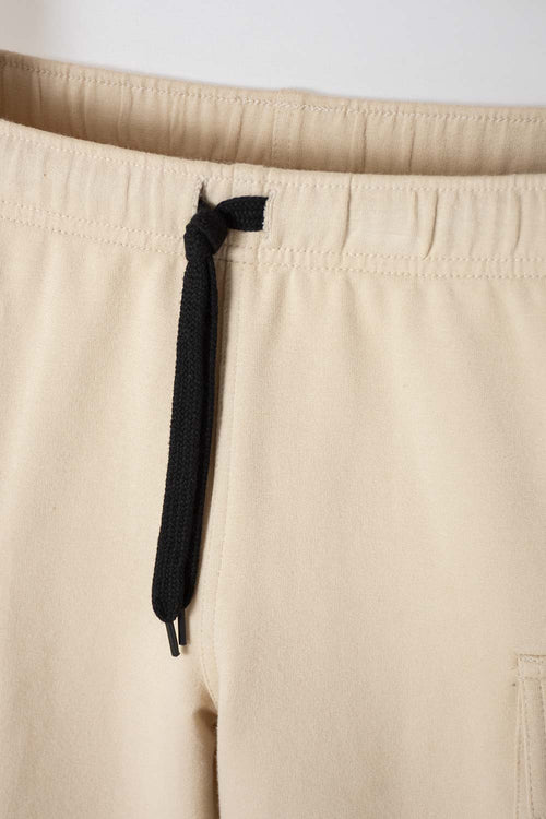 Card slide image -  BERMUDA DE MIC CON BOLSILLOS LATERALES BEIGE PARA NIÑO