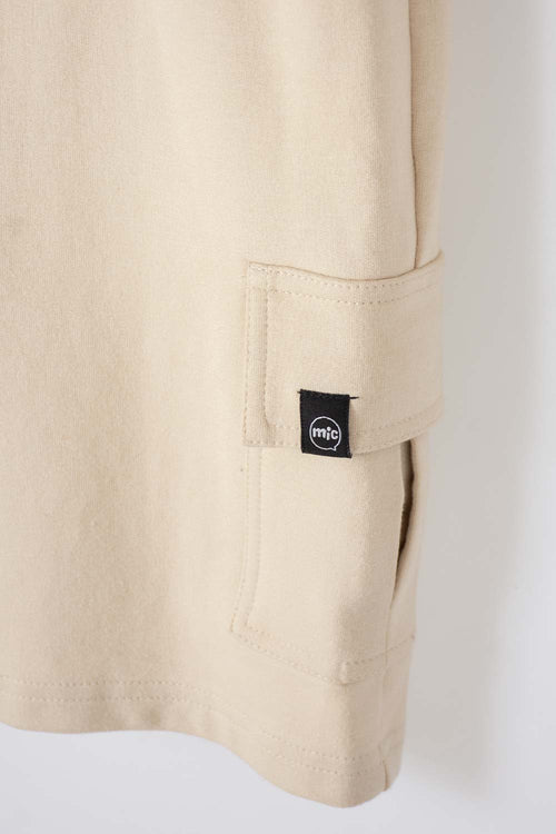 Card slide image -  BERMUDA DE MIC CON BOLSILLOS LATERALES BEIGE PARA NIÑO