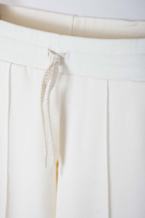 Card slide image -  JOGGER MIC CON CORDÓN MARFIL PARA NIÑA